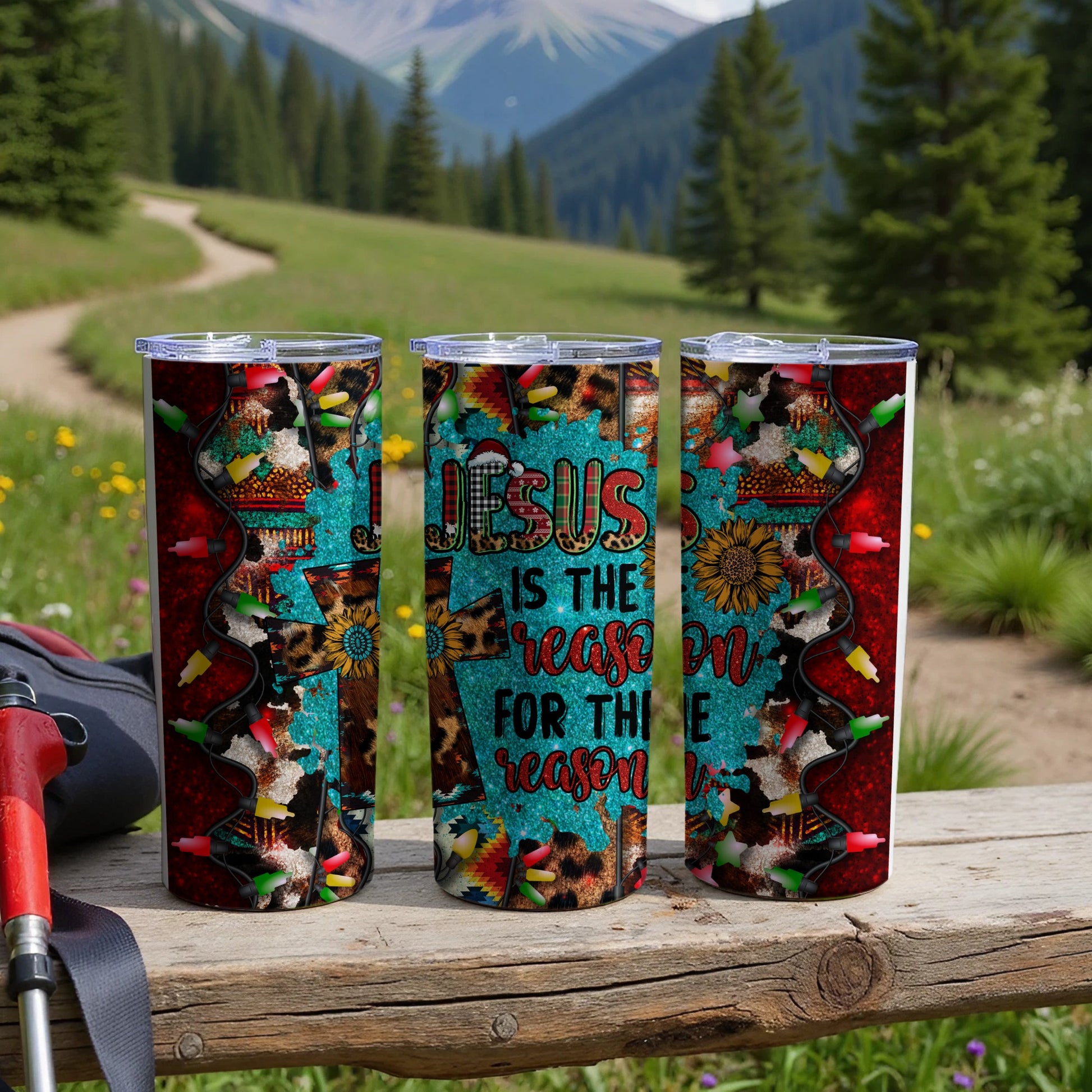 Three tumblers with "Jesus is the reason for the season" text and festive, country-themed designs.