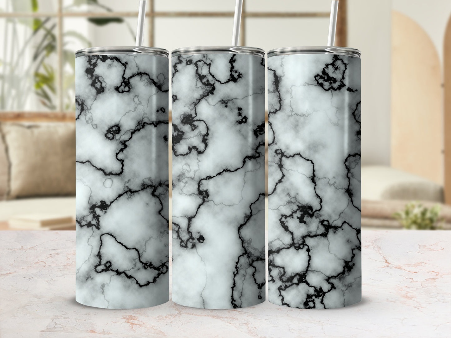 Three tumblers with a white and black marble pattern.