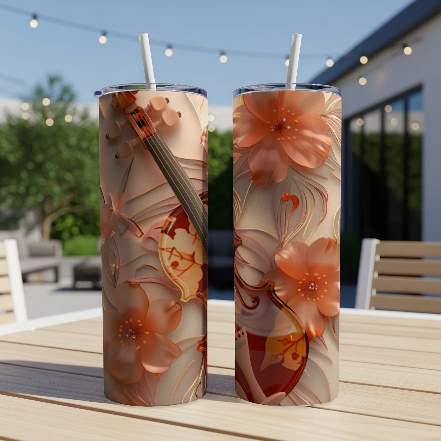 Two tumblers with floral and violin designs on a table.