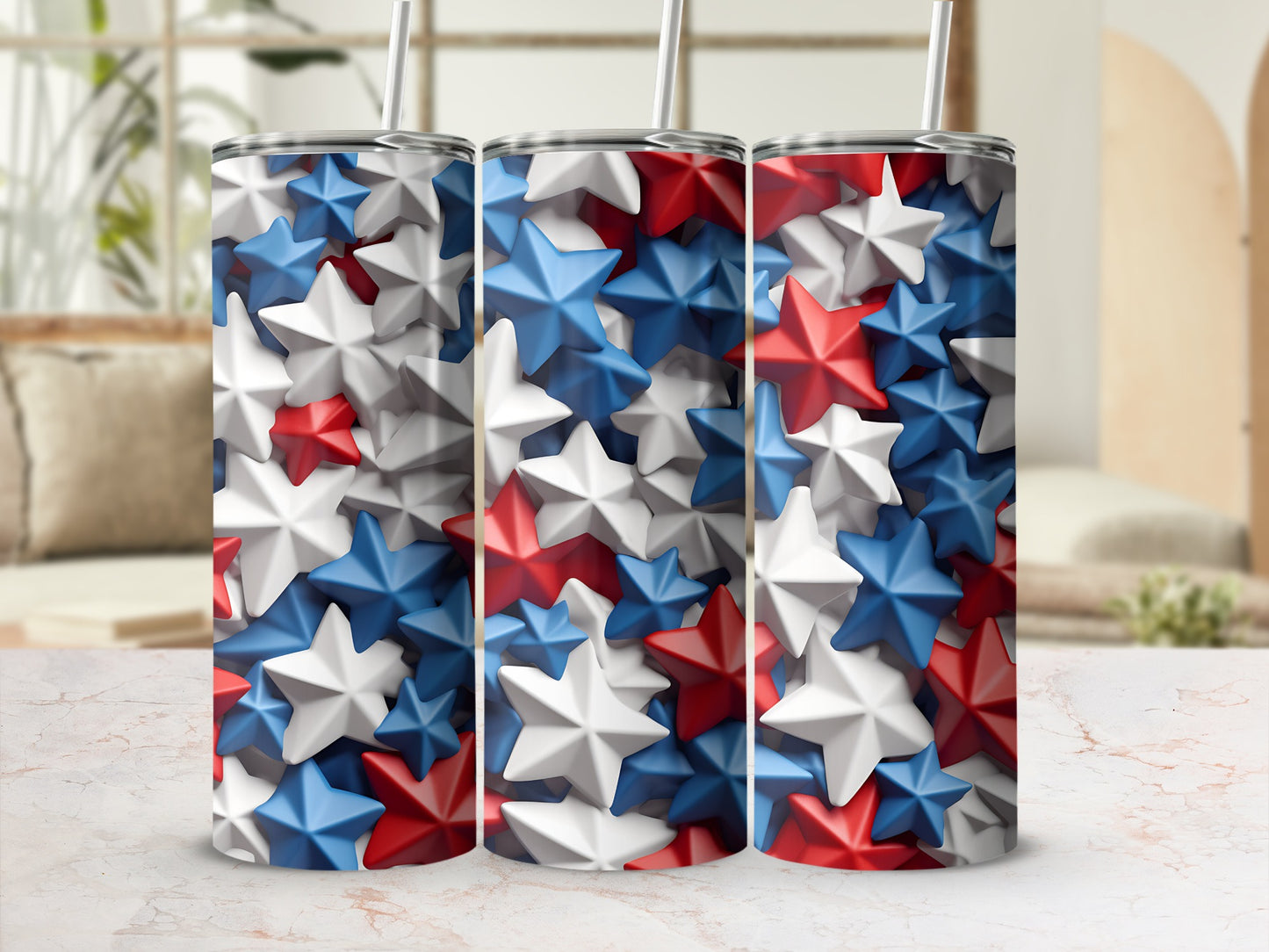 Three tumblers with red, white, and blue star patterns, each with a straw.