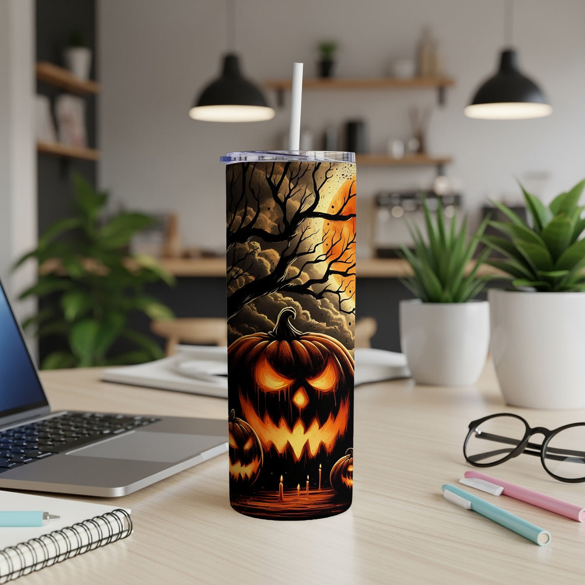 Tall tumbler with a spooky jack-o'-lantern and bare tree Halloween design.