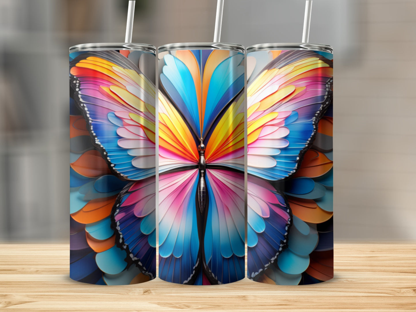 Three tumblers featuring a colorful butterfly design.