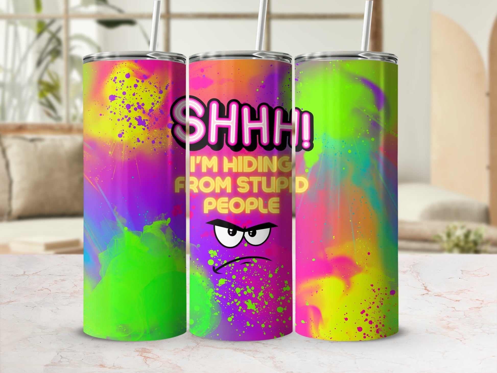 "SHHH! I'M HIDING FROM STUPID PEOPLE" graphic on a colorful, abstract design tumbler.