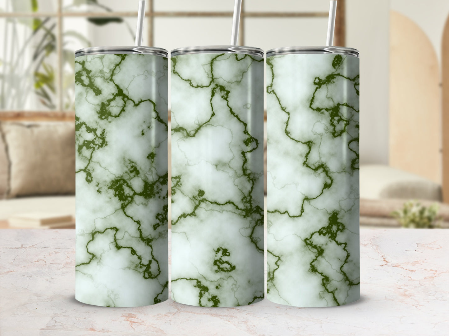 Three tumblers with a green marble pattern stand on a surface.