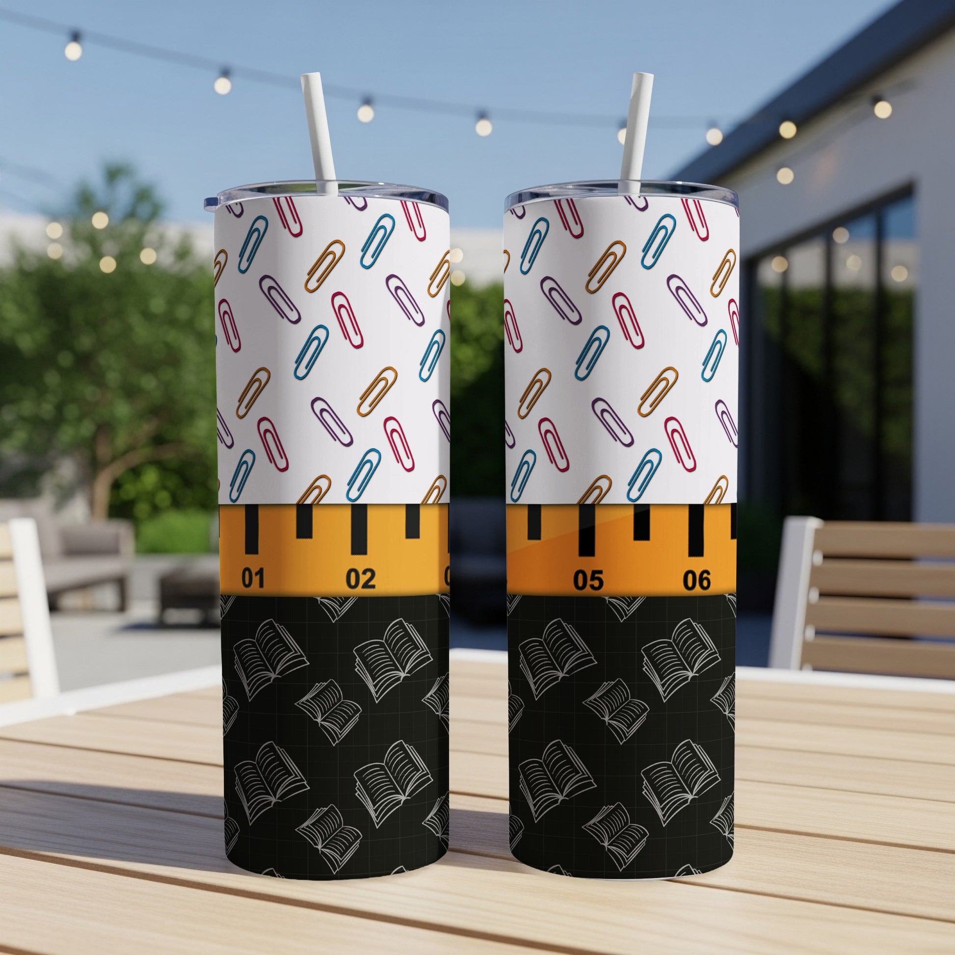 Two tumblers with a ruler design and book pattern.