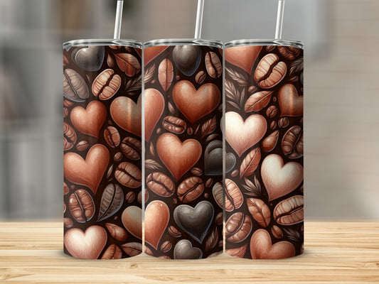 Three tumblers with coffee beans and heart pattern.