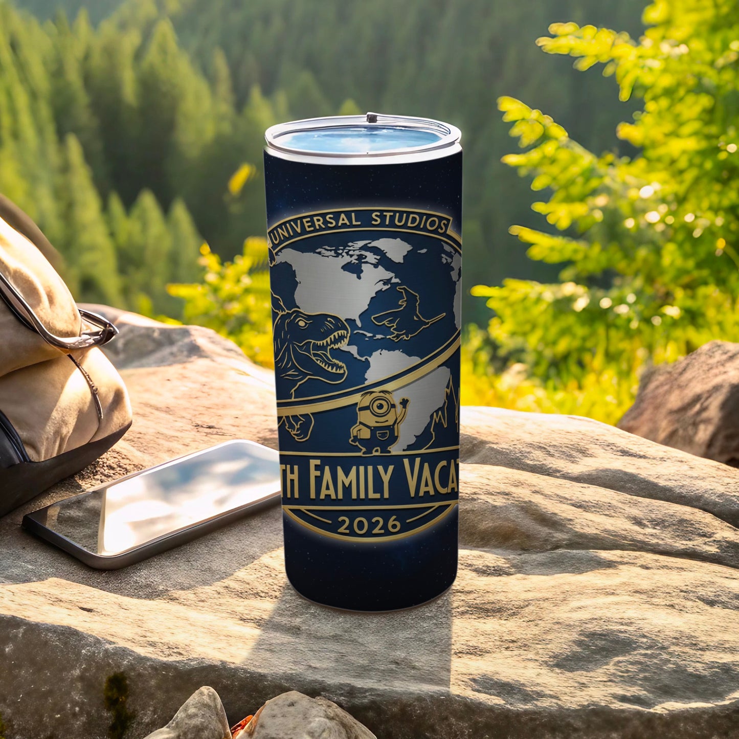 Universal Studios travel tumbler with globe, dinosaur, and Minion, and "Family Vacation 2026".