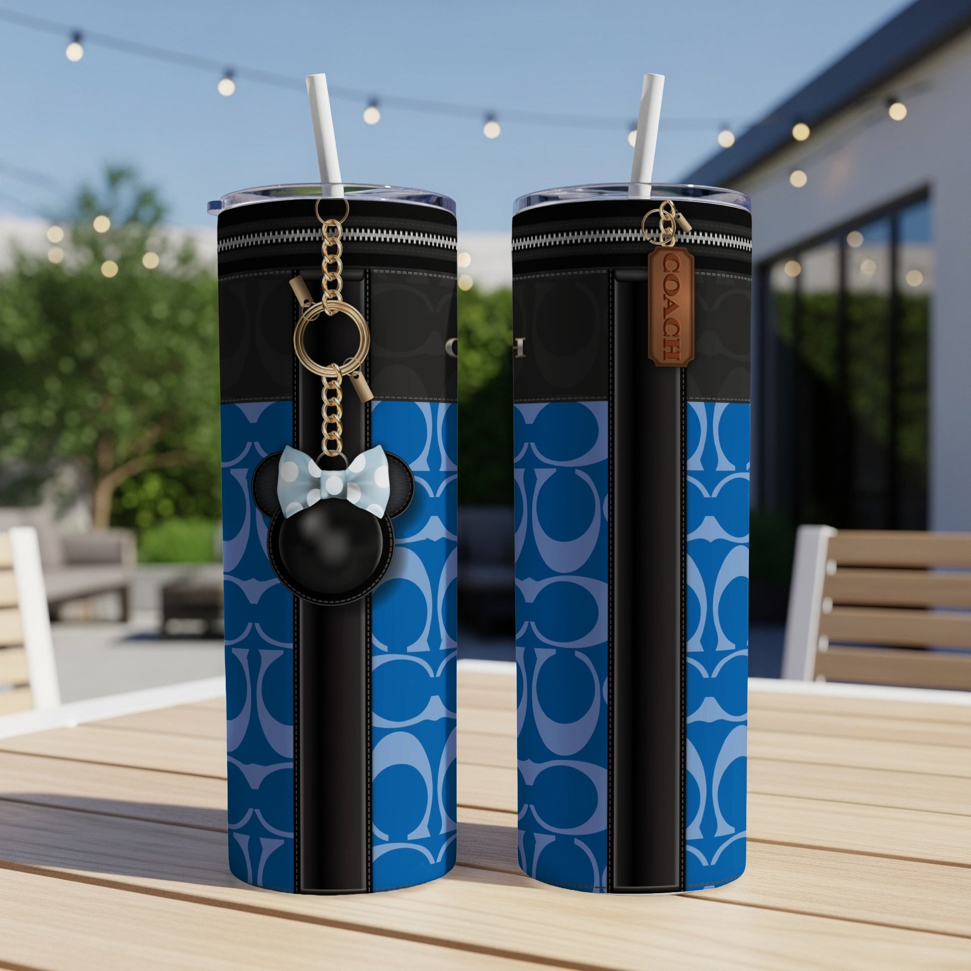 Two Coach tumblers with blue circle pattern and Minnie Mouse keychain.