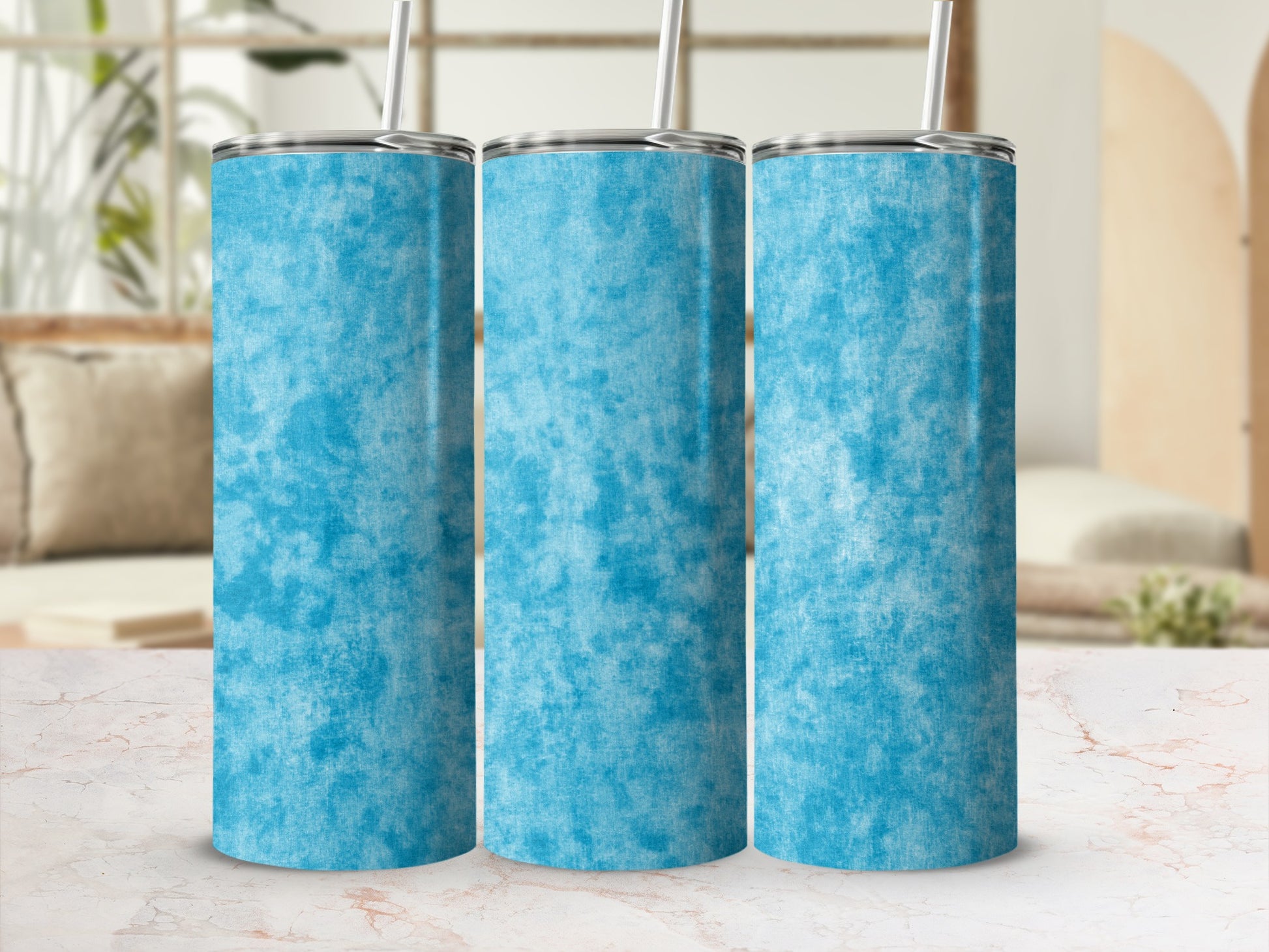 Three tall tumblers with a textured blue pattern and metal lids.