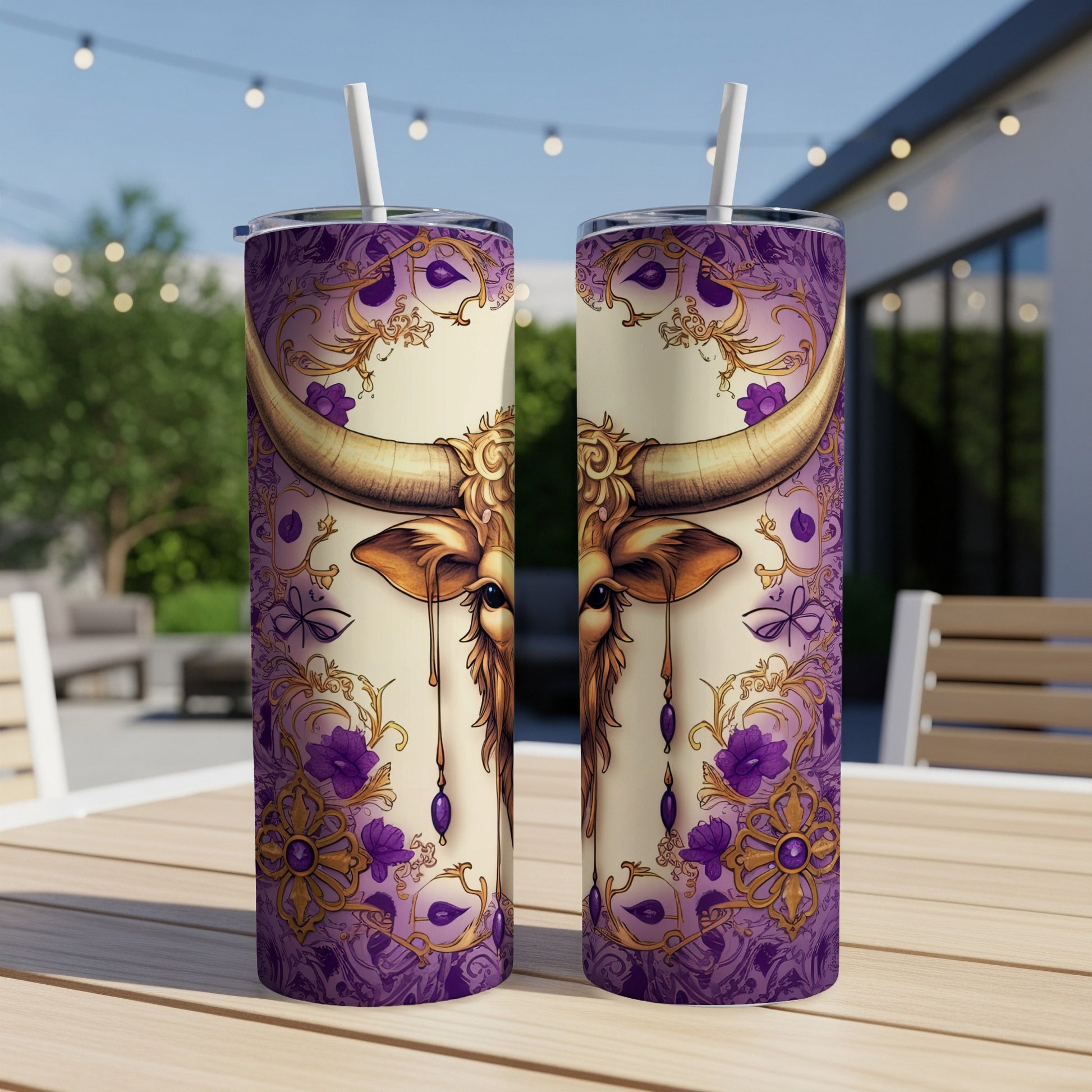 Taurus zodiac design on two tall, insulated tumblers with straws.