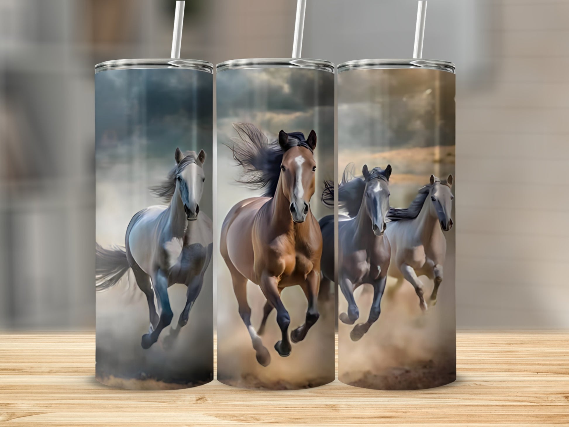 Three horses gallop through dust, a tumbler design.