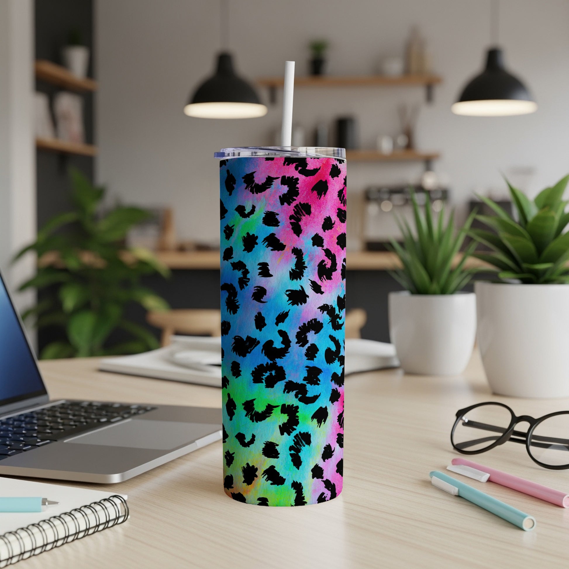 Tumbler with colorful tie-dye and black leopard print; includes straw.