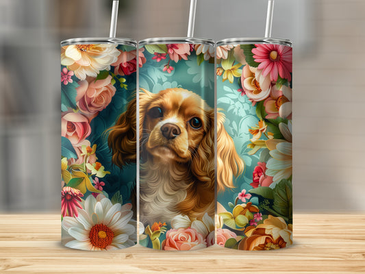 Triptych of tumblers featuring a Cavalier King Charles Spaniel surrounded by colorful flowers.