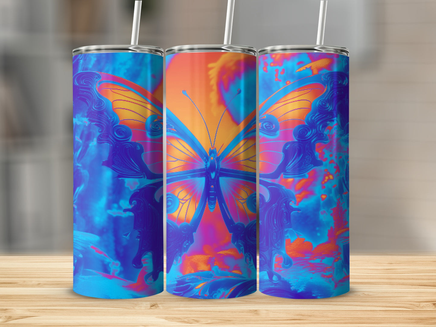 Three tumblers with a vibrant blue and orange butterfly design.