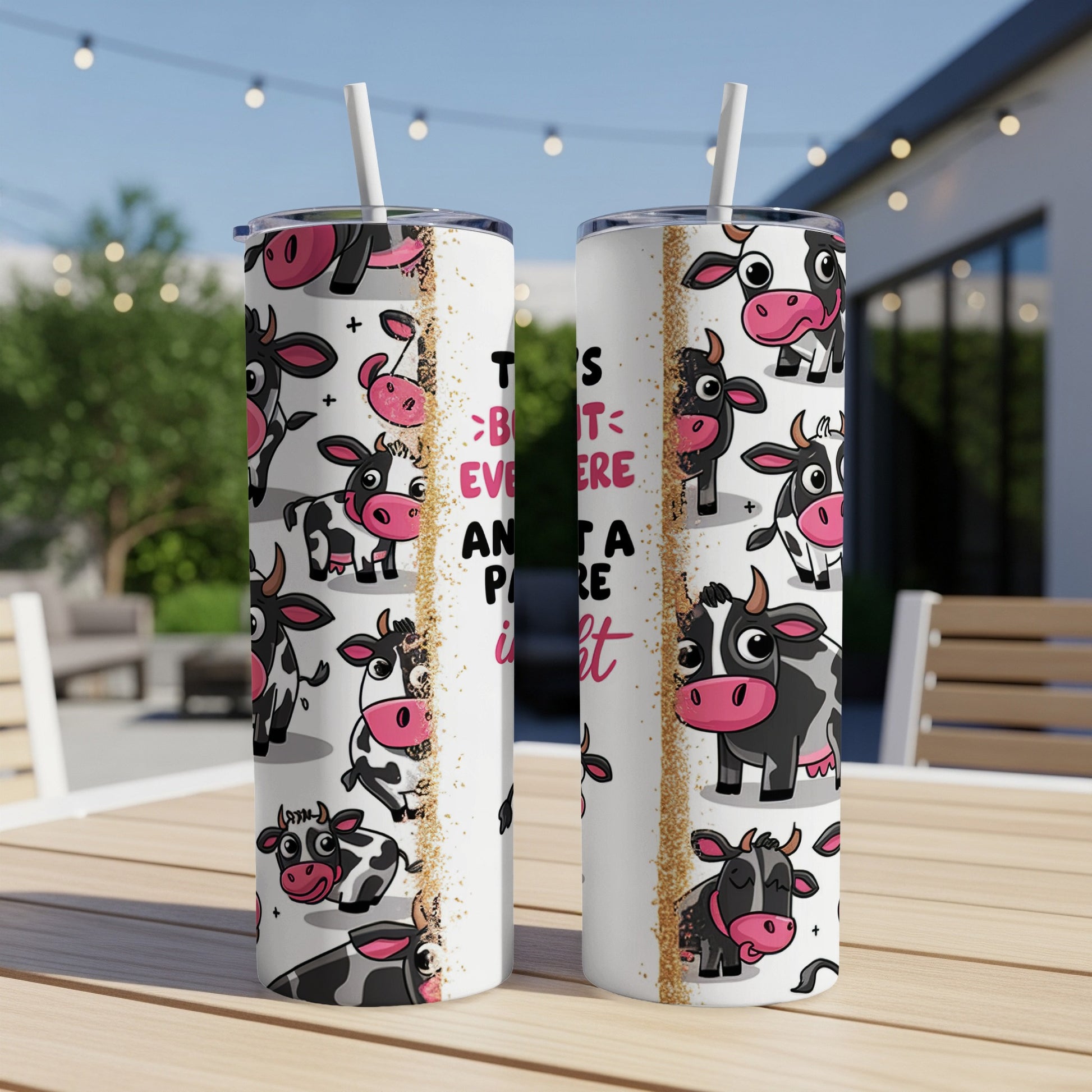 Cow pattern tumbler with "This year is better and a little bit moo-re" text.