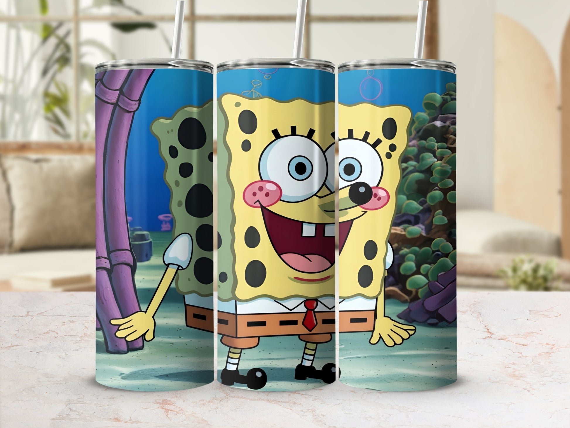 SpongeBob SquarePants smiling with a red tie, on a three-tumbler display.