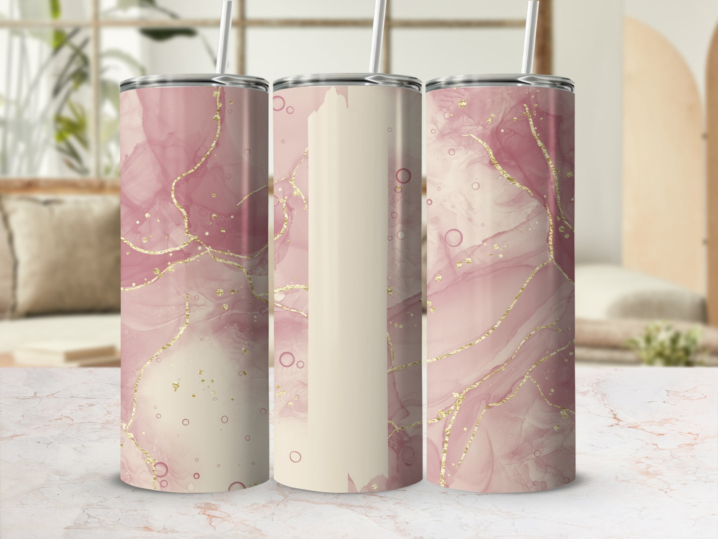 Pink and beige marble tumbler with gold accents and straw.