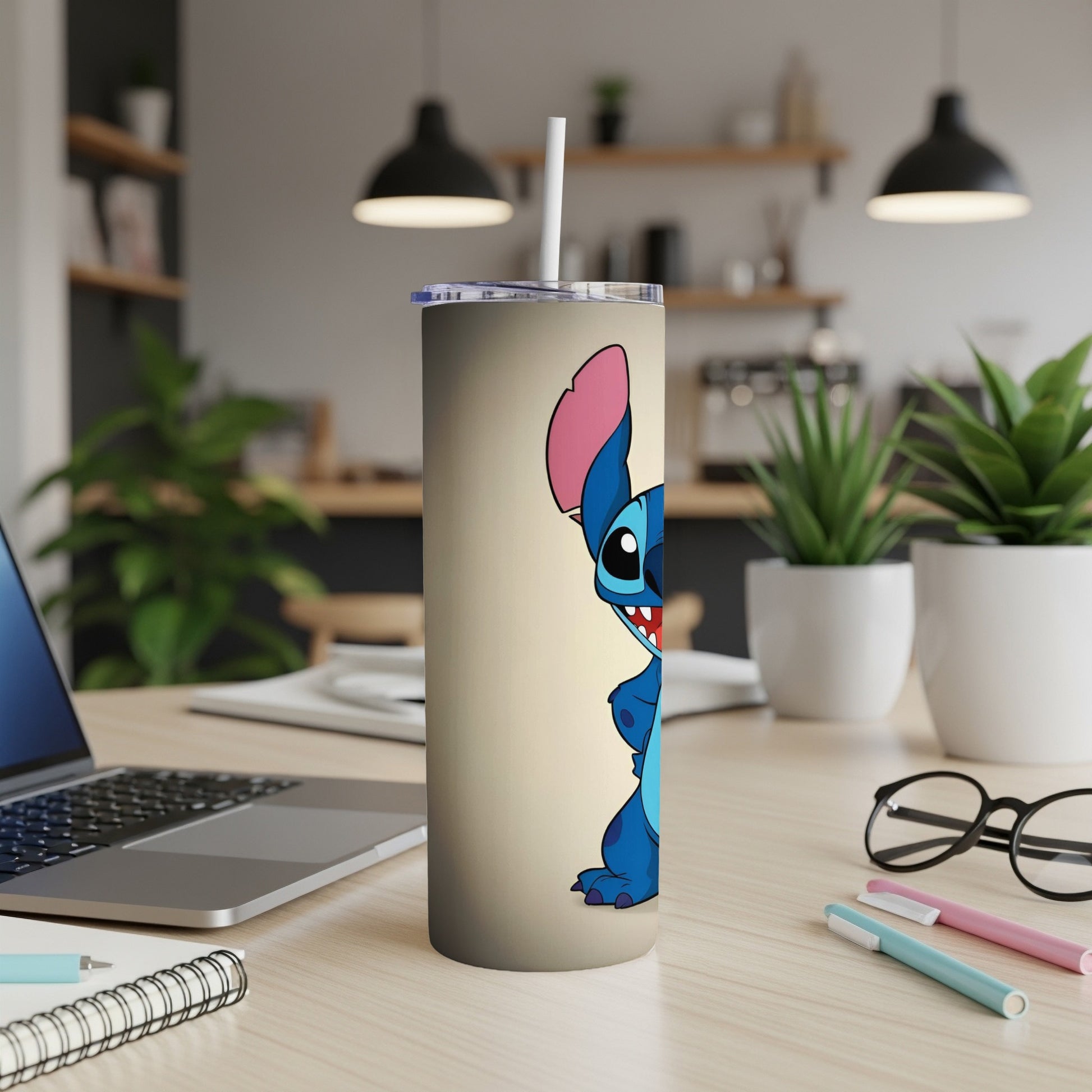 Blue Stitch character peeking from the side on a tan tumbler.