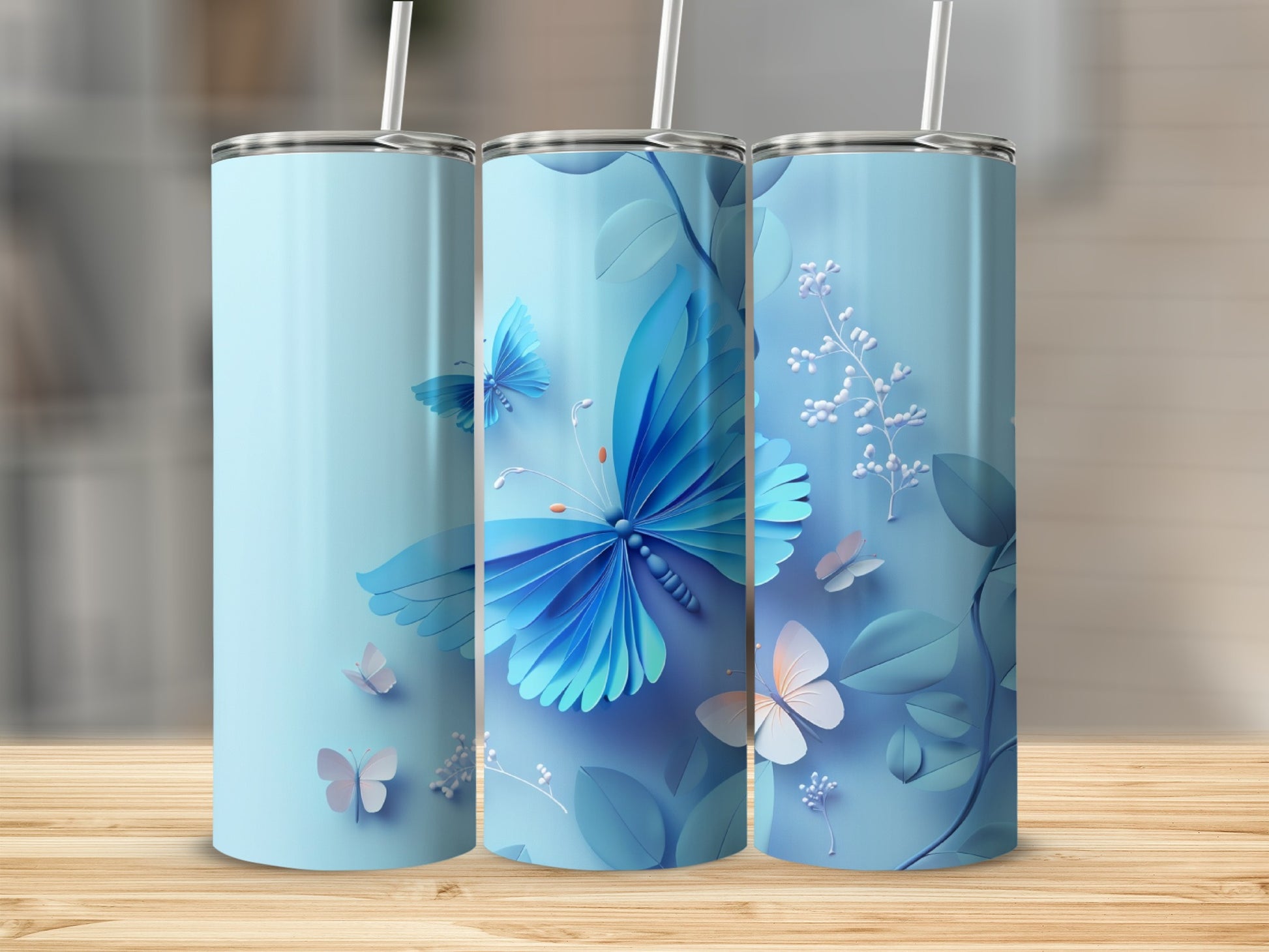 Blue tumbler with butterflies and floral accents.