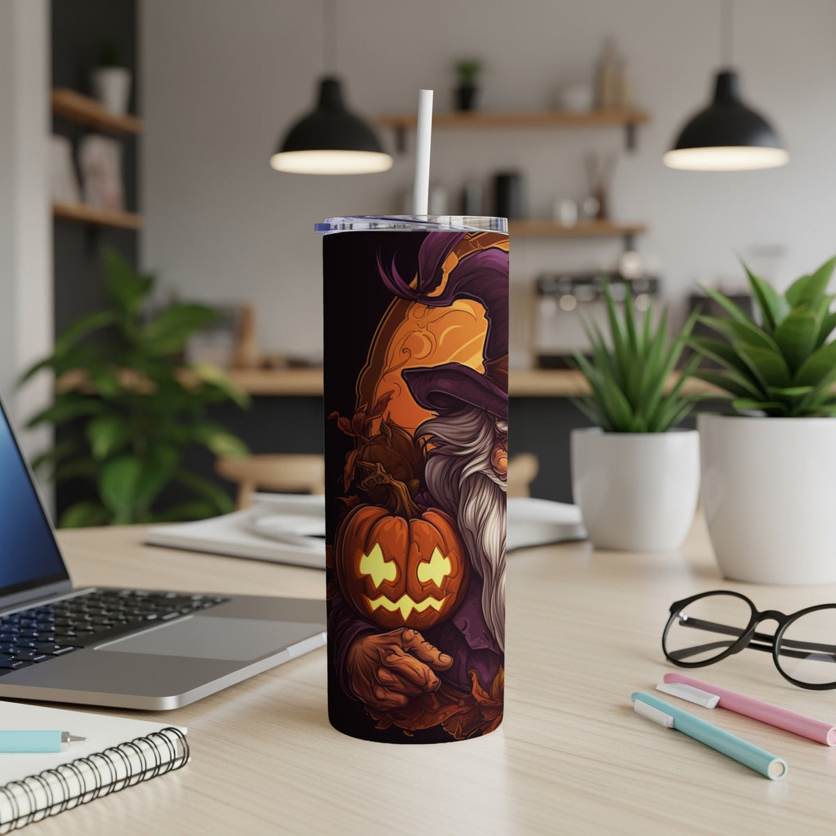 Halloween tumbler with witch, pumpkin, and moon illustration.