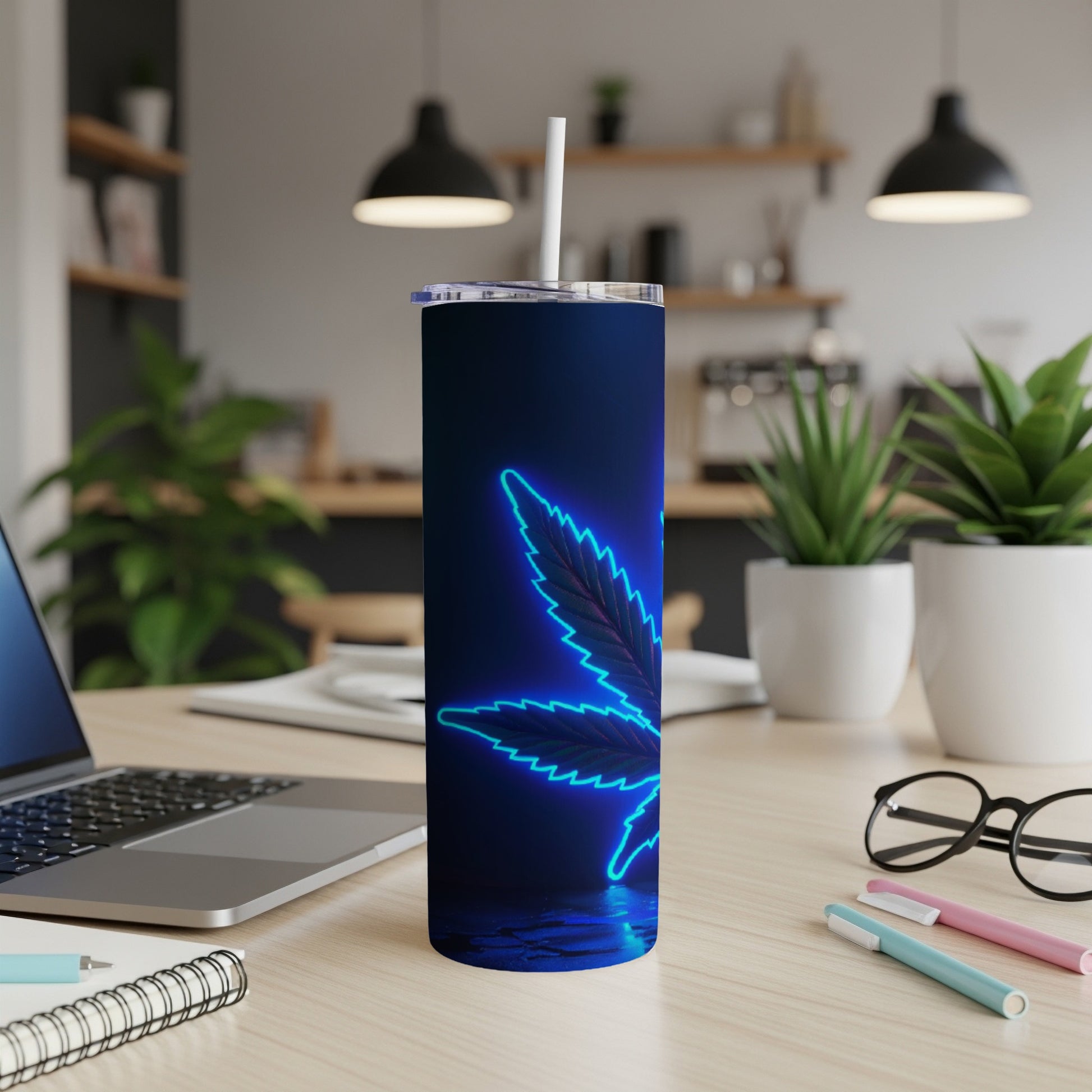 Blue neon cannabis leaf design on a dark, reflective surface tumbler.