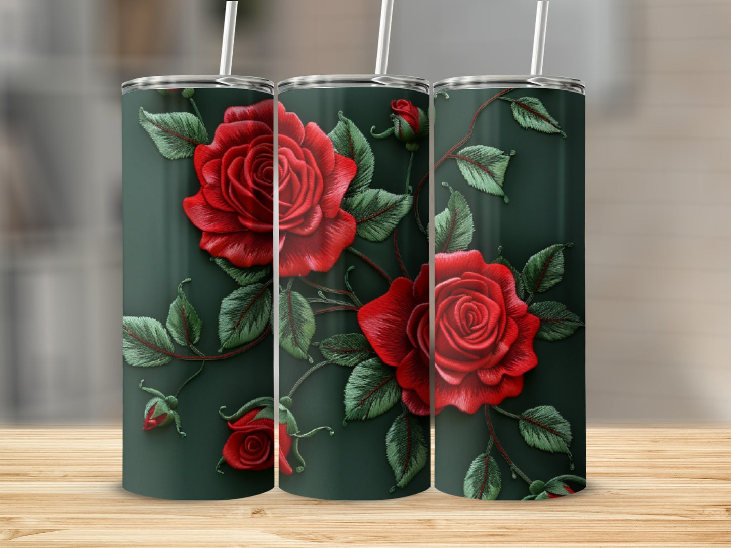 Three tumblers with a red rose and green leaf embroidered design.