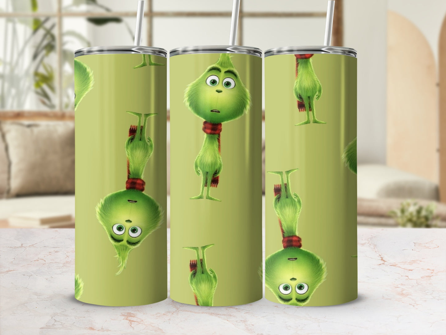 Grinch character design repeating on a light green tumbler with a straw.