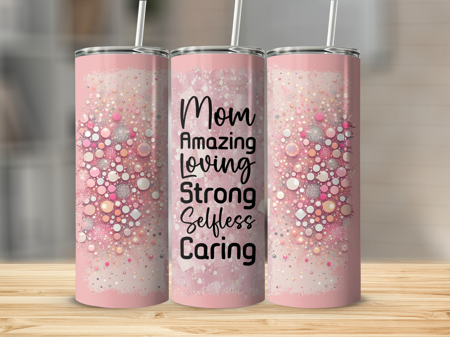 Pink tumbler with "Mom Amazing Loving Strong Selfless Caring" text and glittery circles.