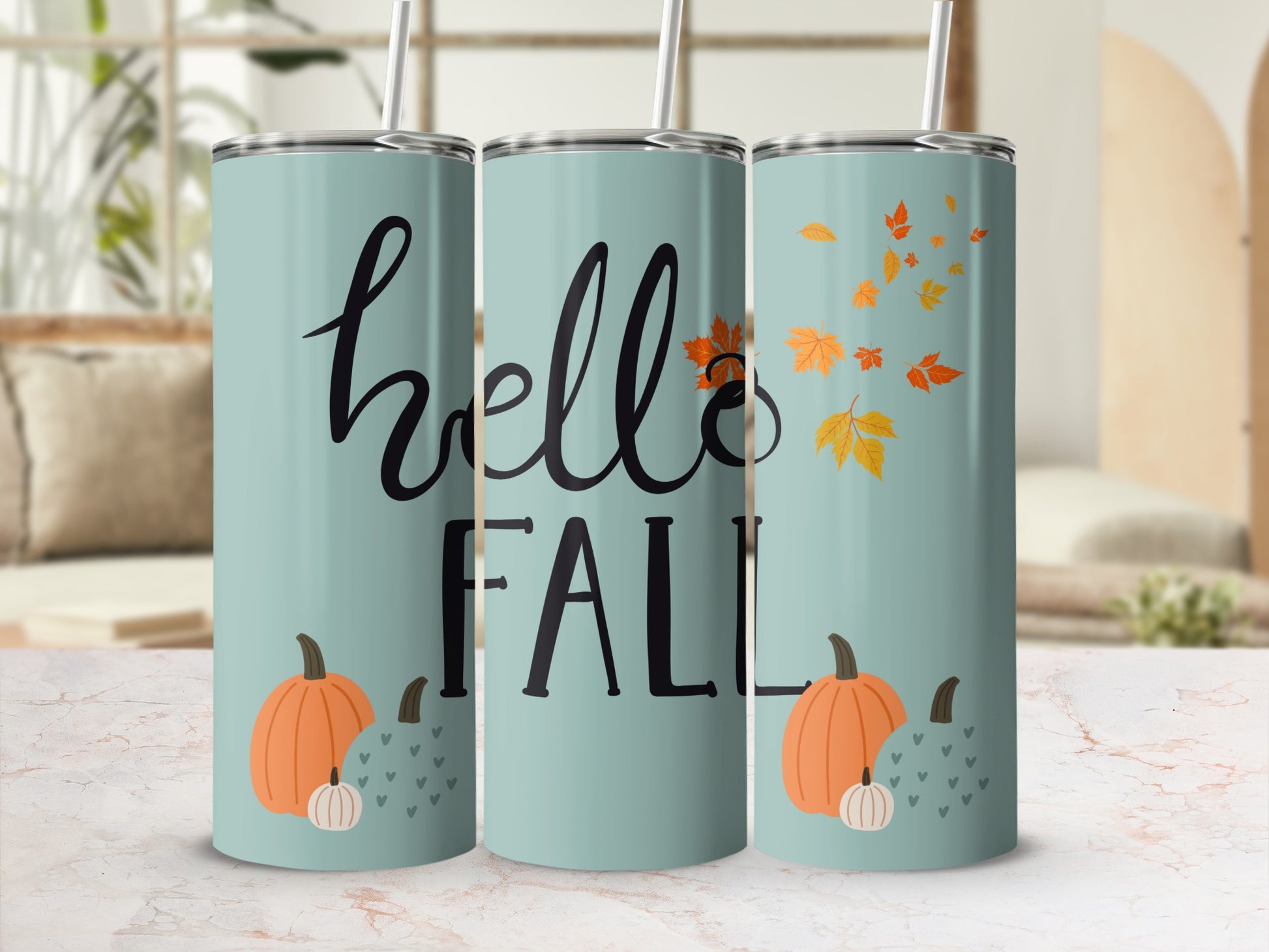 Three teal tumblers with "hello FALL" and pumpkin and leaf designs.