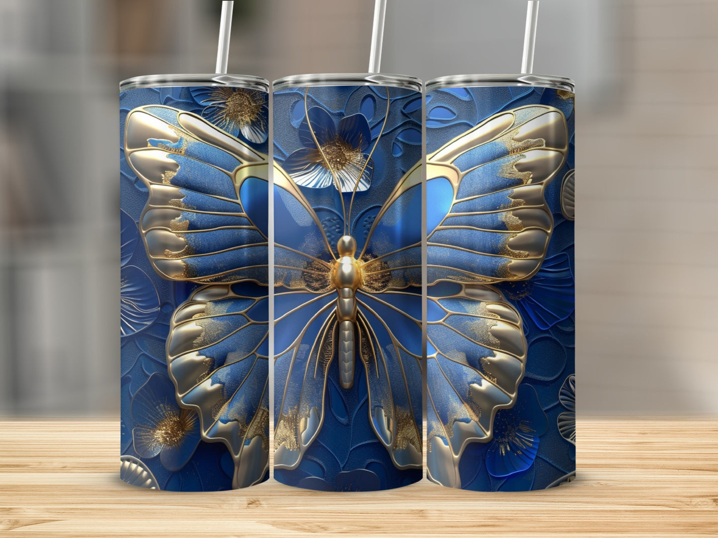 Three tumblers with a blue butterfly and floral design.