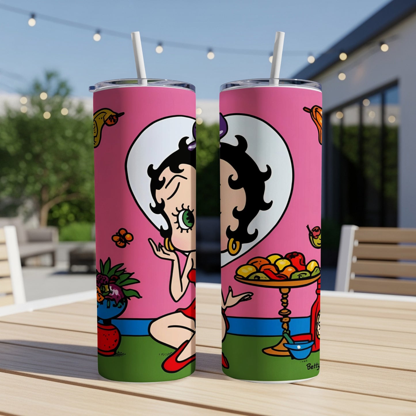 Betty Boop illustration with fruit and flowers on a pink background.