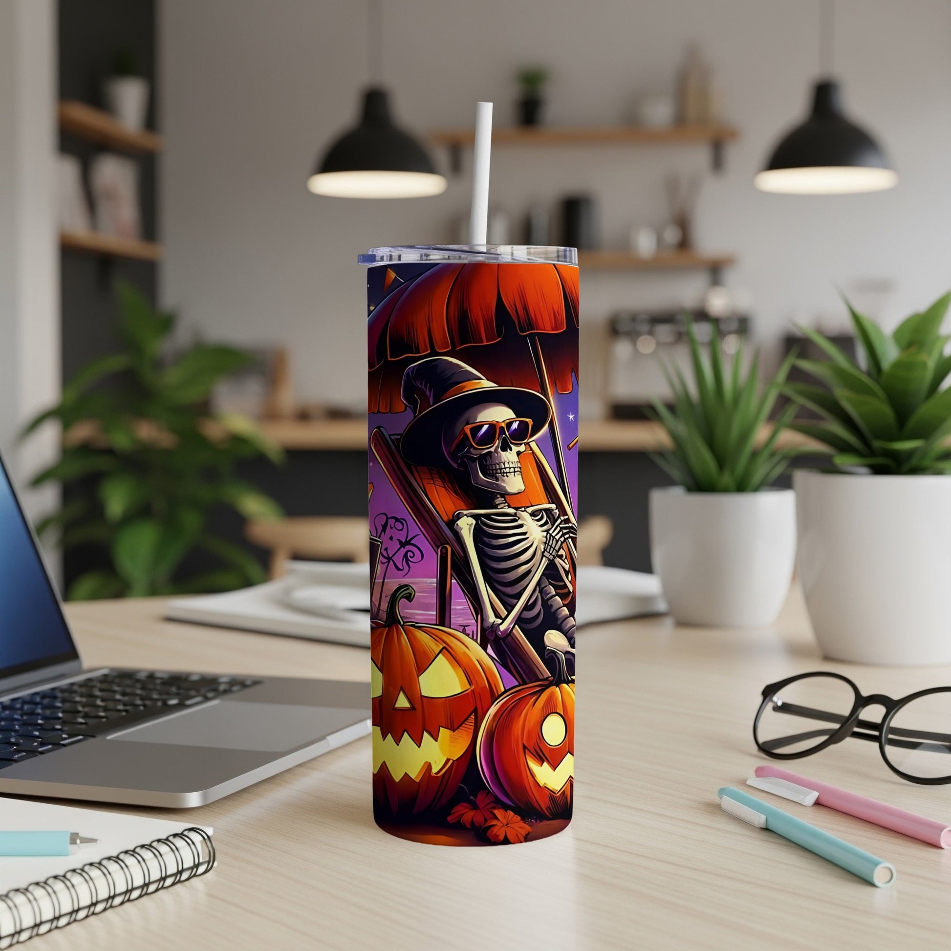 Tumbler with skeleton, sunglasses, hat, pumpkins, and an umbrella.