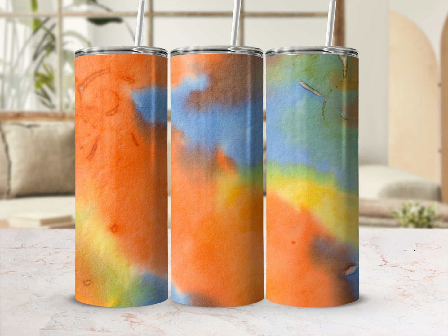 Three tumblers with colorful abstract watercolor designs.