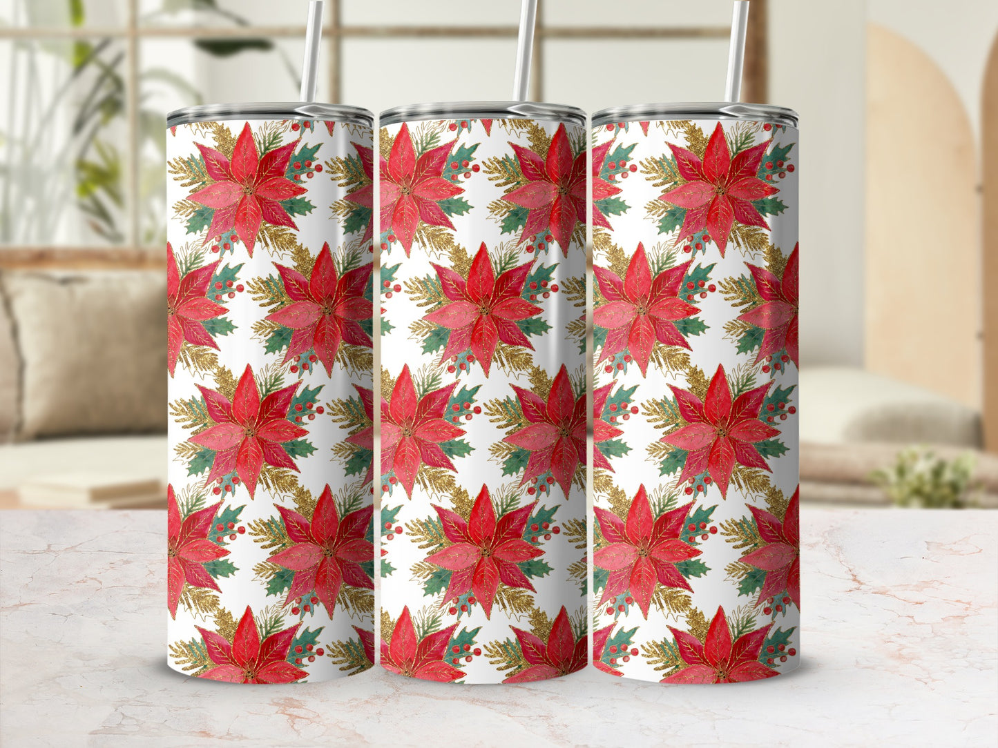 Three tumblers with red poinsettias and gold accents on a white background.