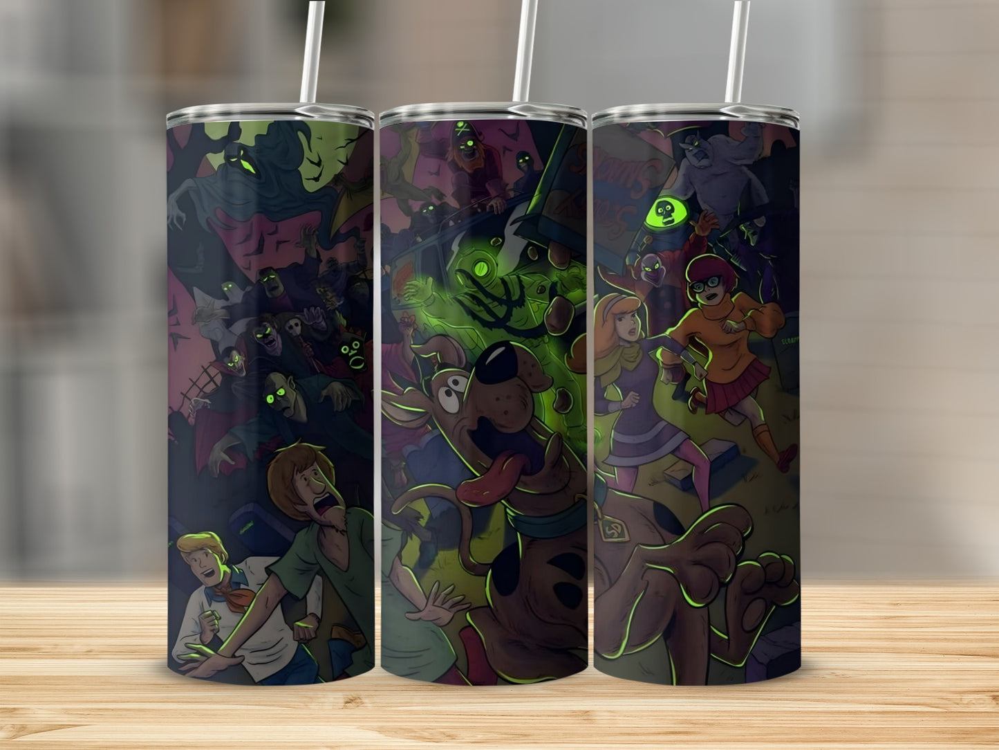 Scooby-Doo characters in a spooky, colorful cartoon scene on three tumblers.