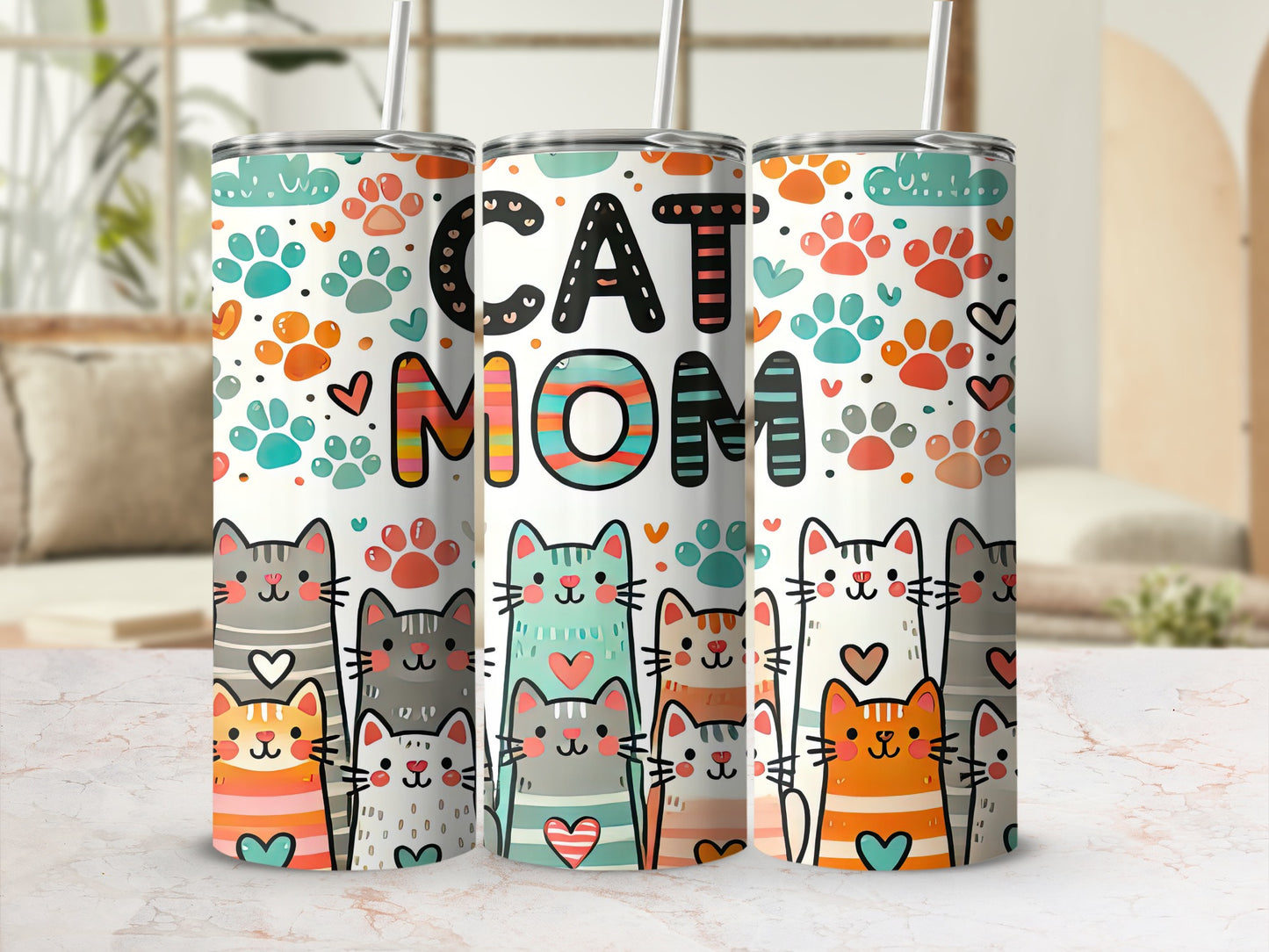 "Cat Mom" tumbler with colorful cats and paw prints.
