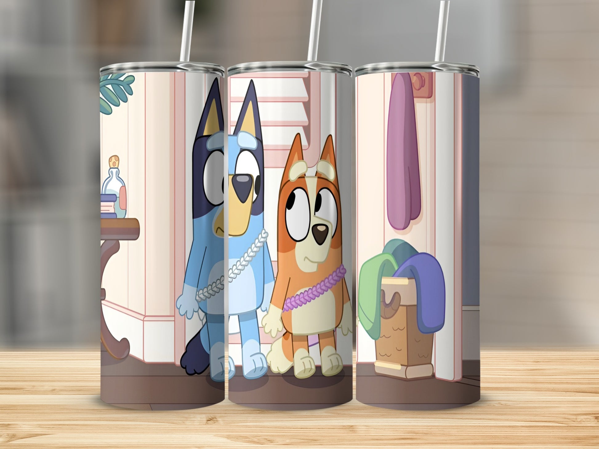 Bluey and Bingo characters on a tumbler with laundry basket background.