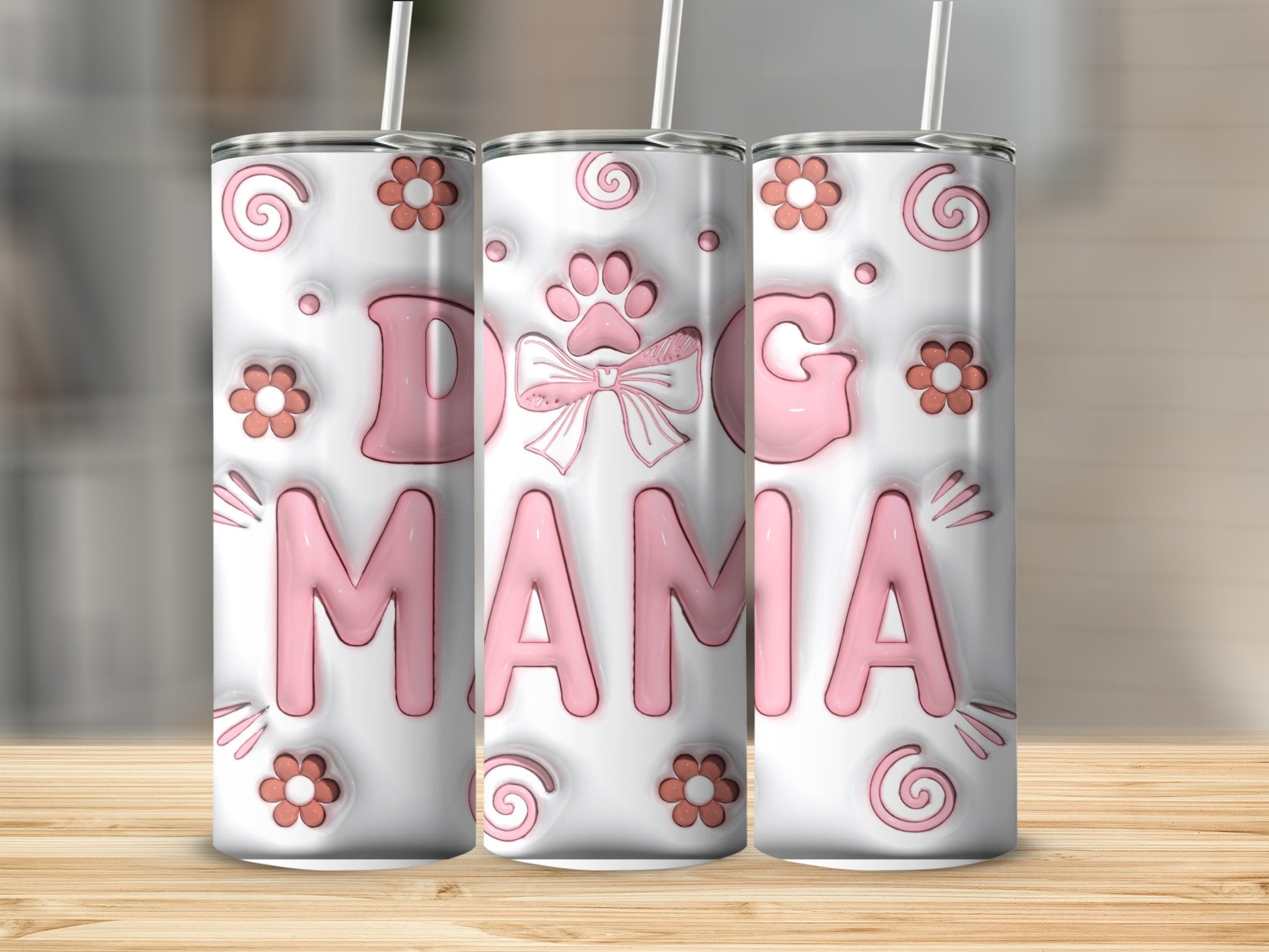 White tumbler with pink "DOG MAMA" text, paw print, and floral accents.