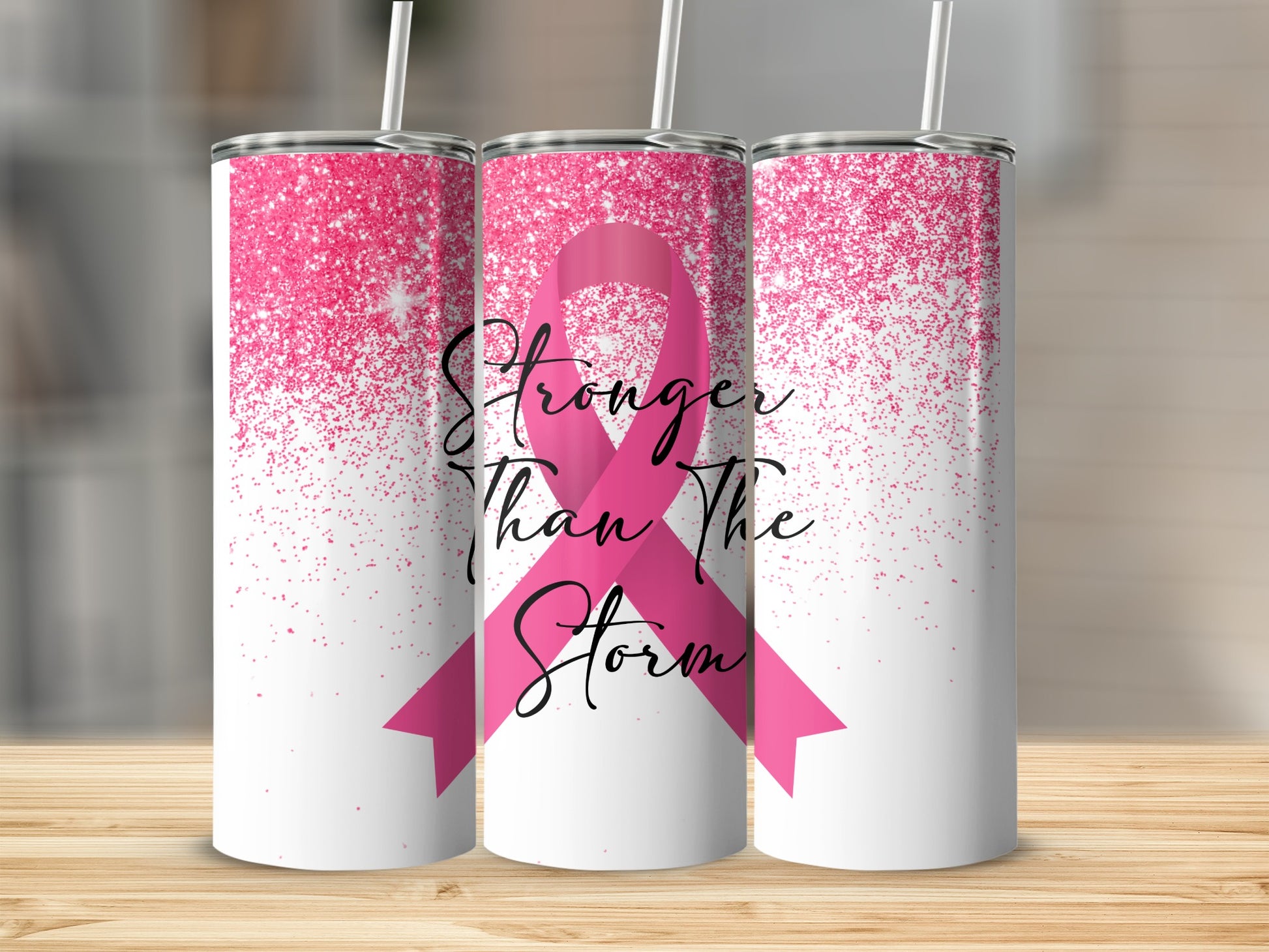 Pink ribbon with "Stronger Than The Storm" text on a tumbler.