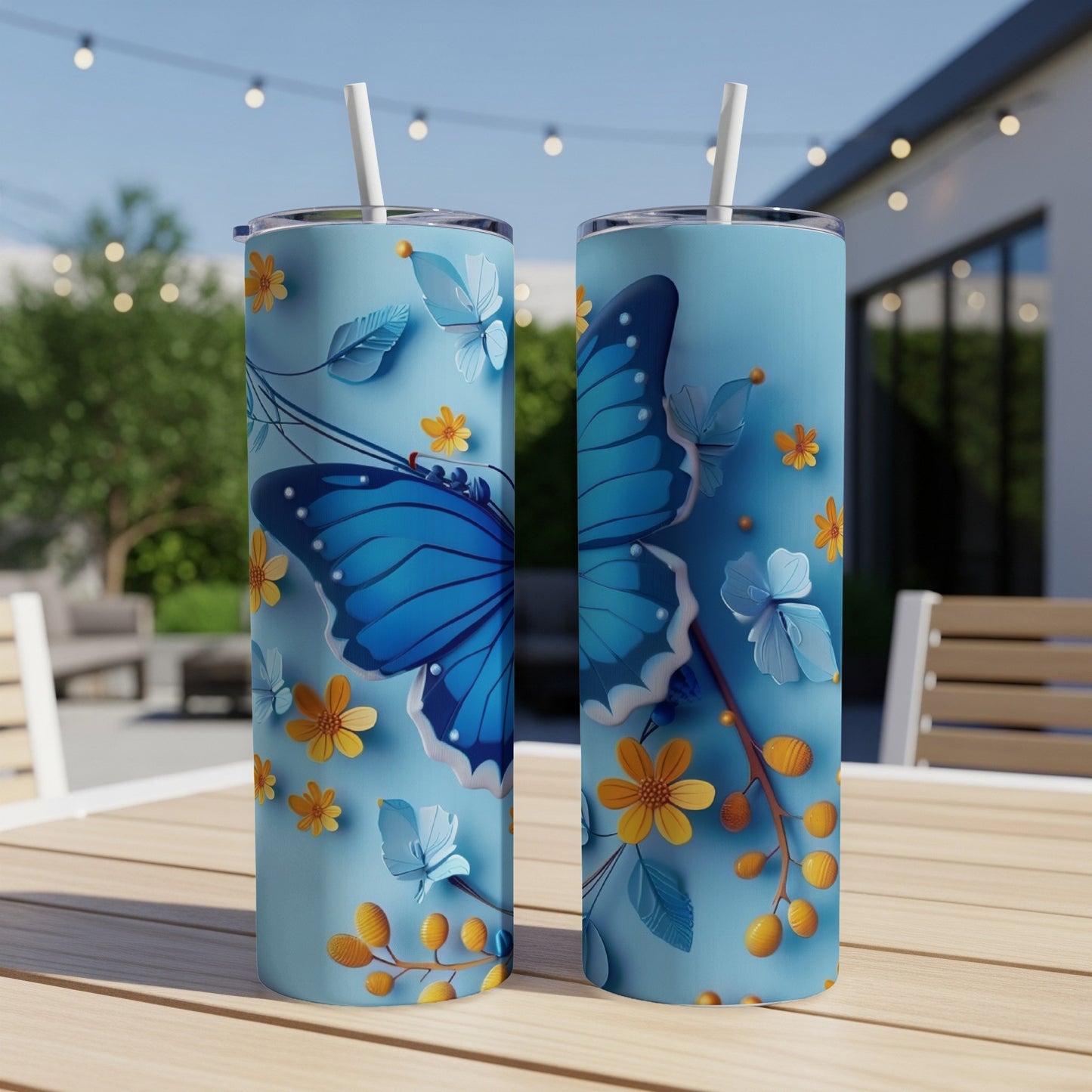 Blue butterfly and floral pattern on two tall, slender tumblers.