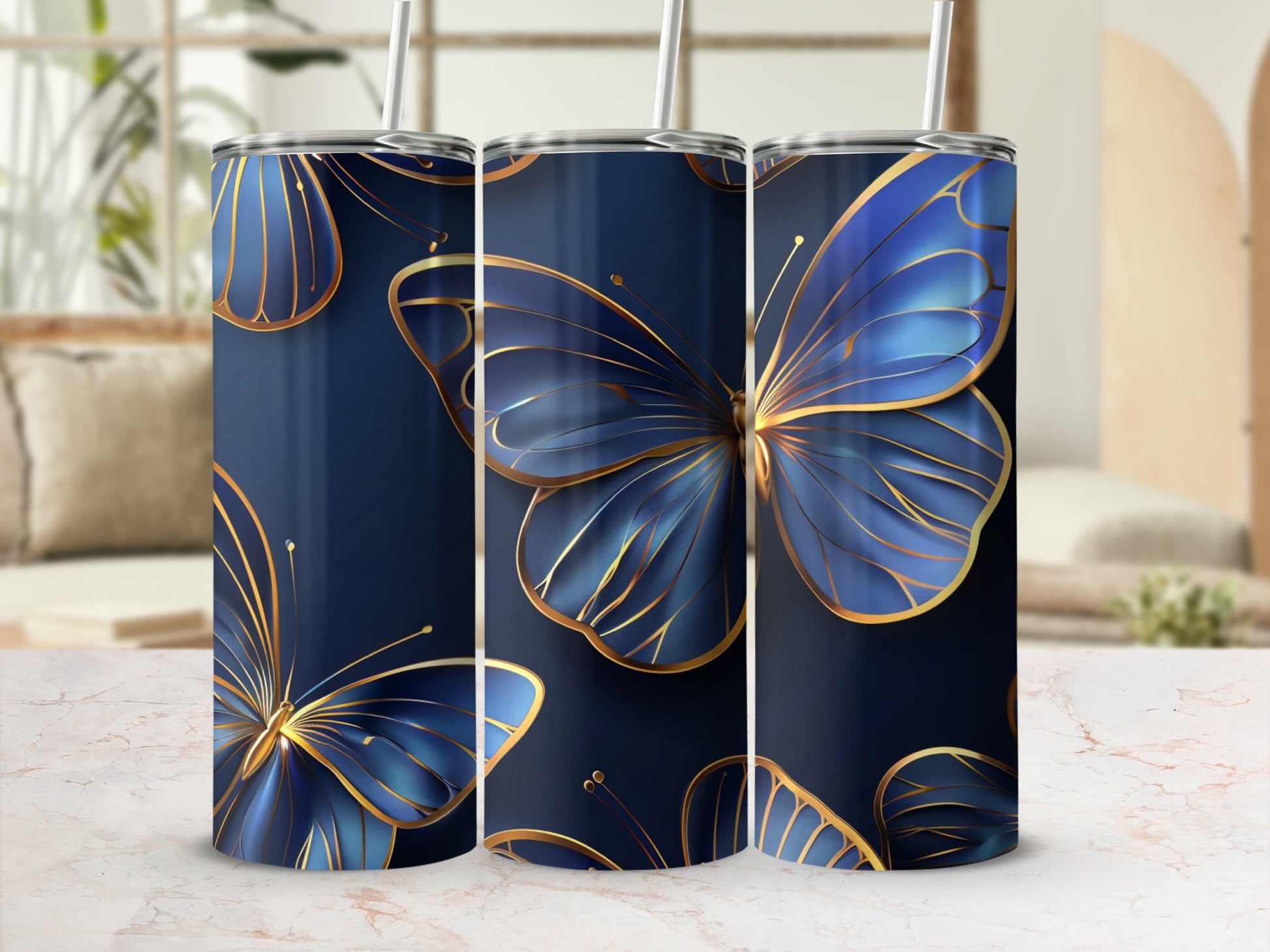 Tall navy tumbler with golden-lined blue butterflies and straw.