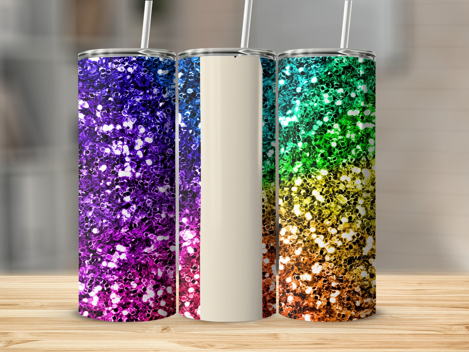 Three tumblers with glitter designs in purple, white, and rainbow colors.