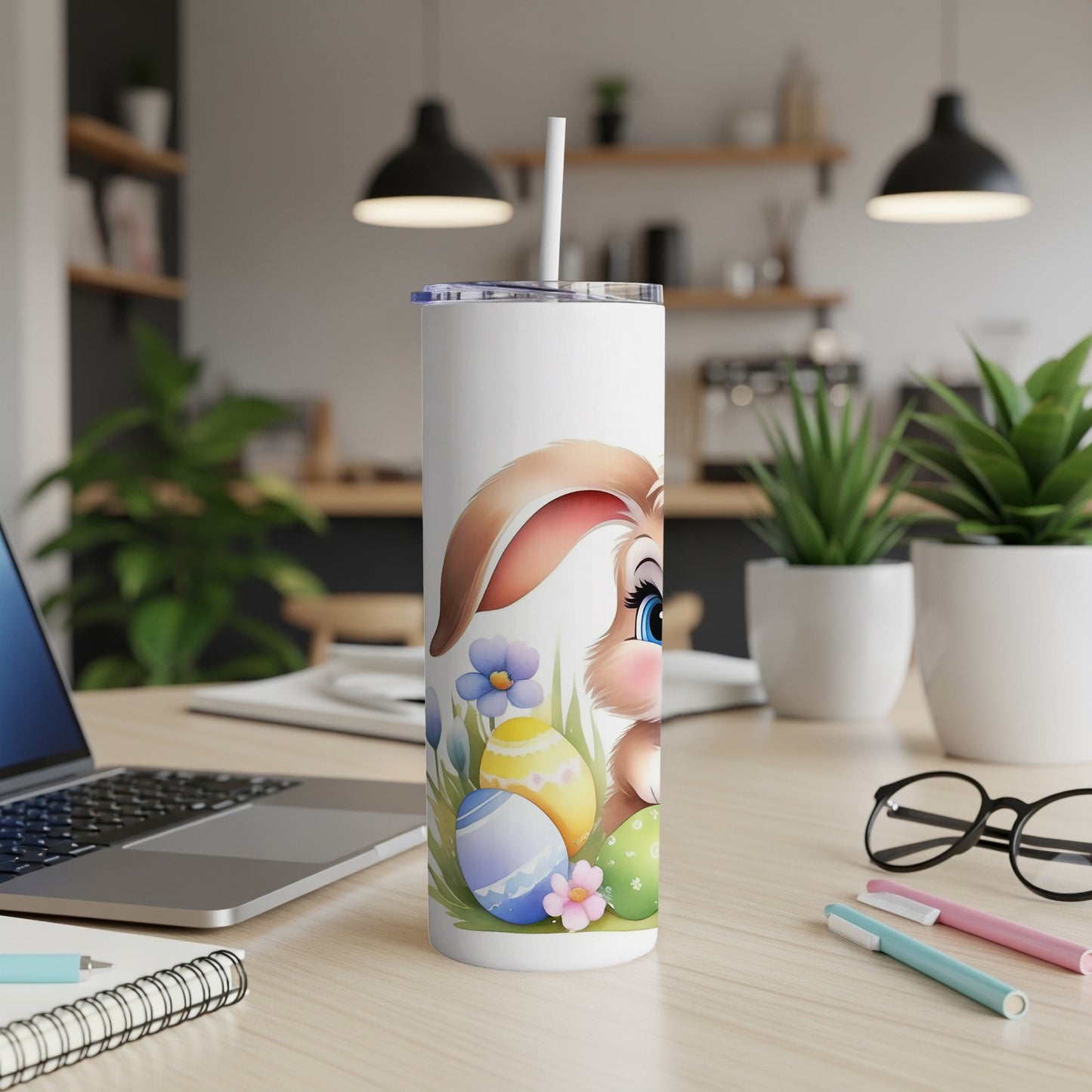 Easter bunny and painted eggs design on a white tumbler with straw.