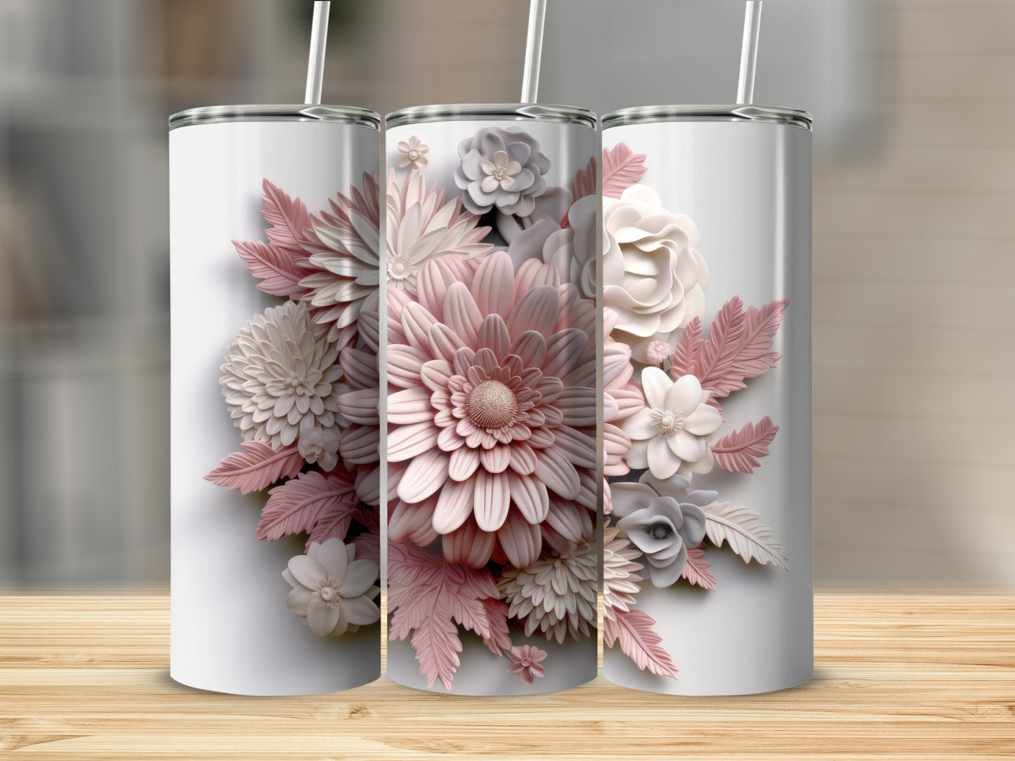 Three white tumblers with detailed floral embellishments in shades of pink and white.