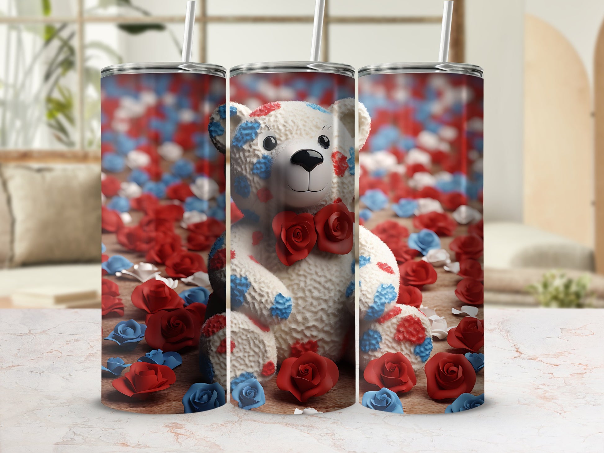 Teddy bear tumbler with red, white, and blue flowers on a marble surface.