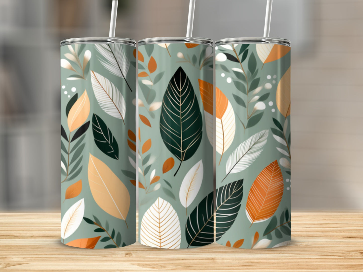 Three tumblers with green, white, and orange leaf pattern.
