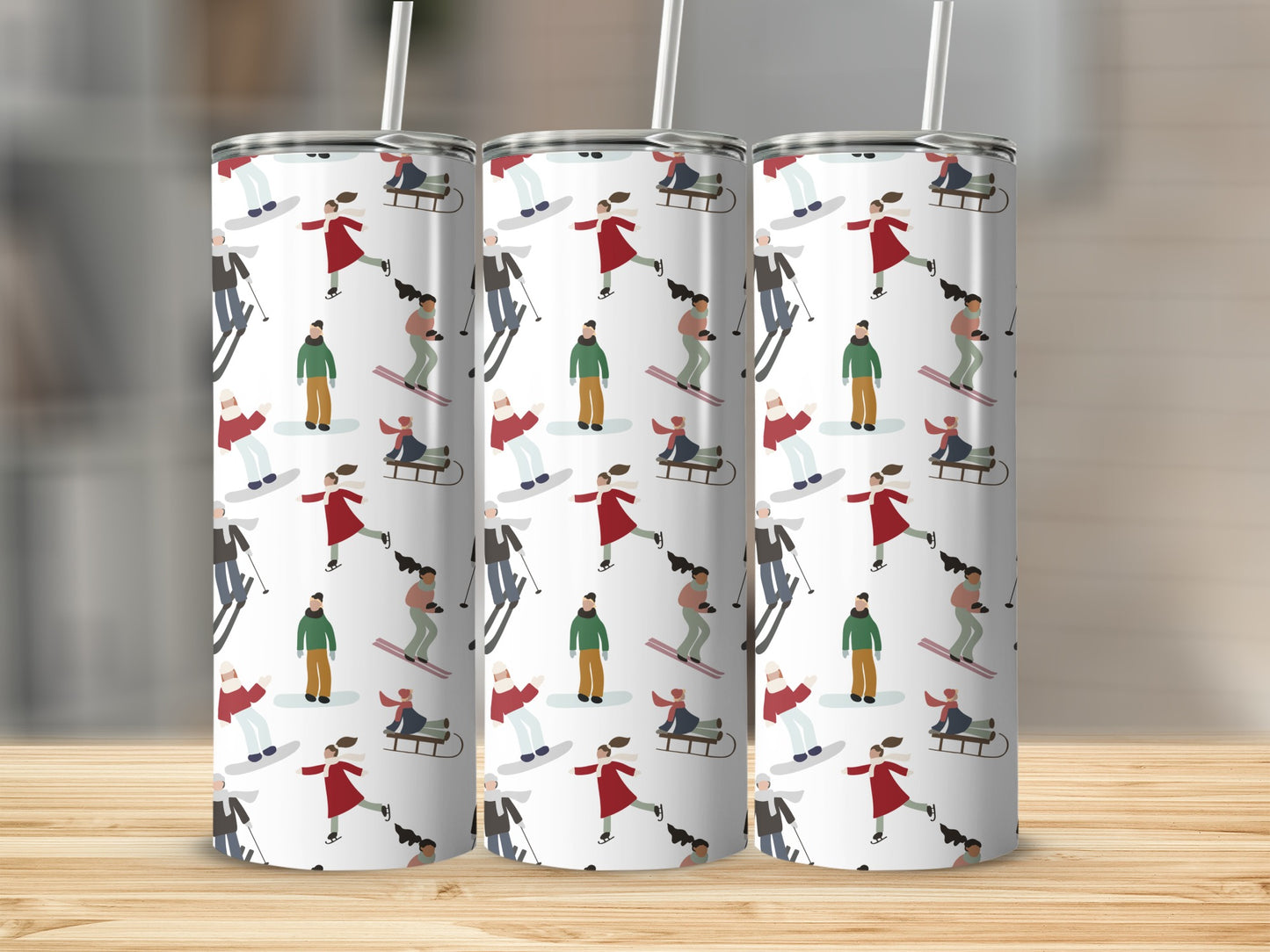 Three white tumblers with a repeating pattern of winter sports figures.