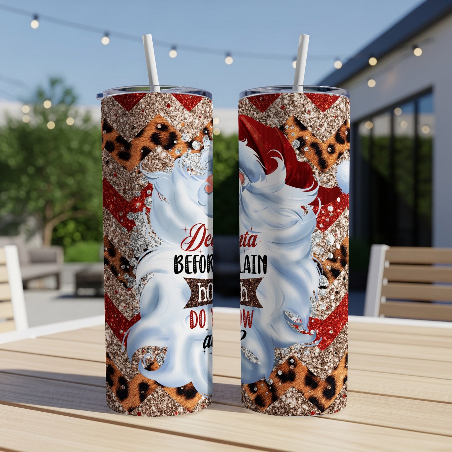 Two Santa Claus tumblers with leopard print and glitter designs.