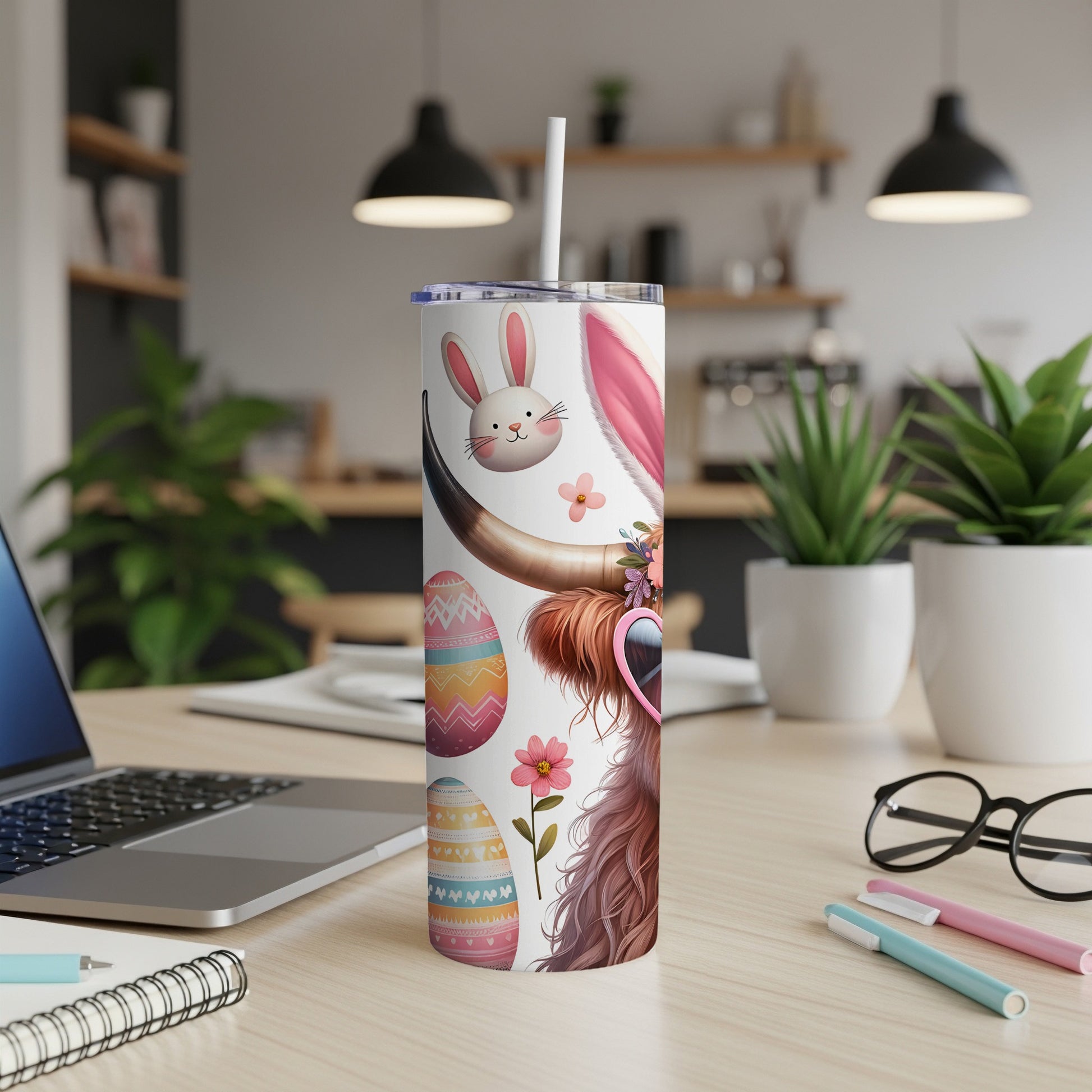 Easter highland cow tumbler with sunglasses, decorated eggs, and bunny ears.