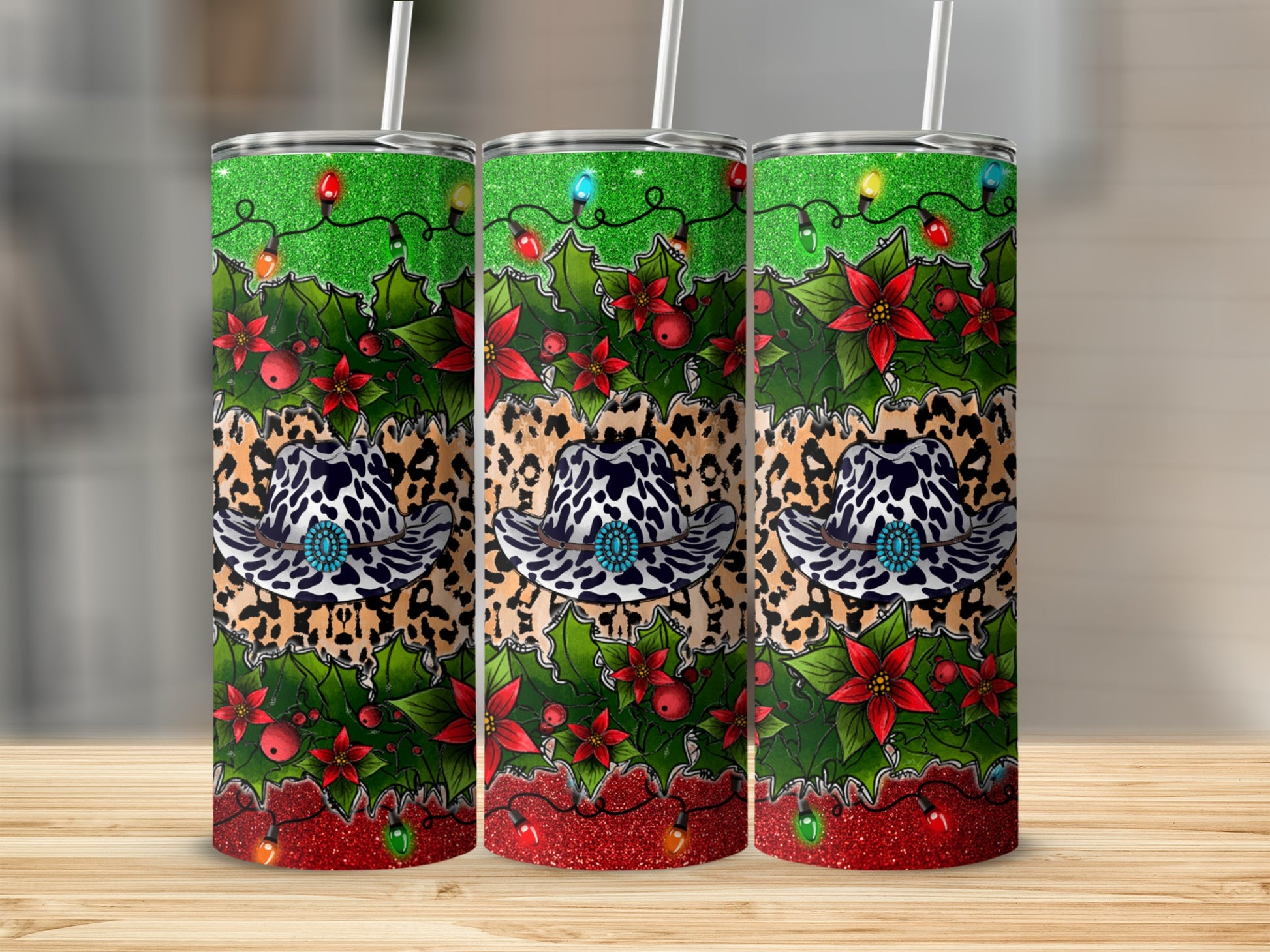 Three holiday tumblers with cowboy hats and Christmas lights.